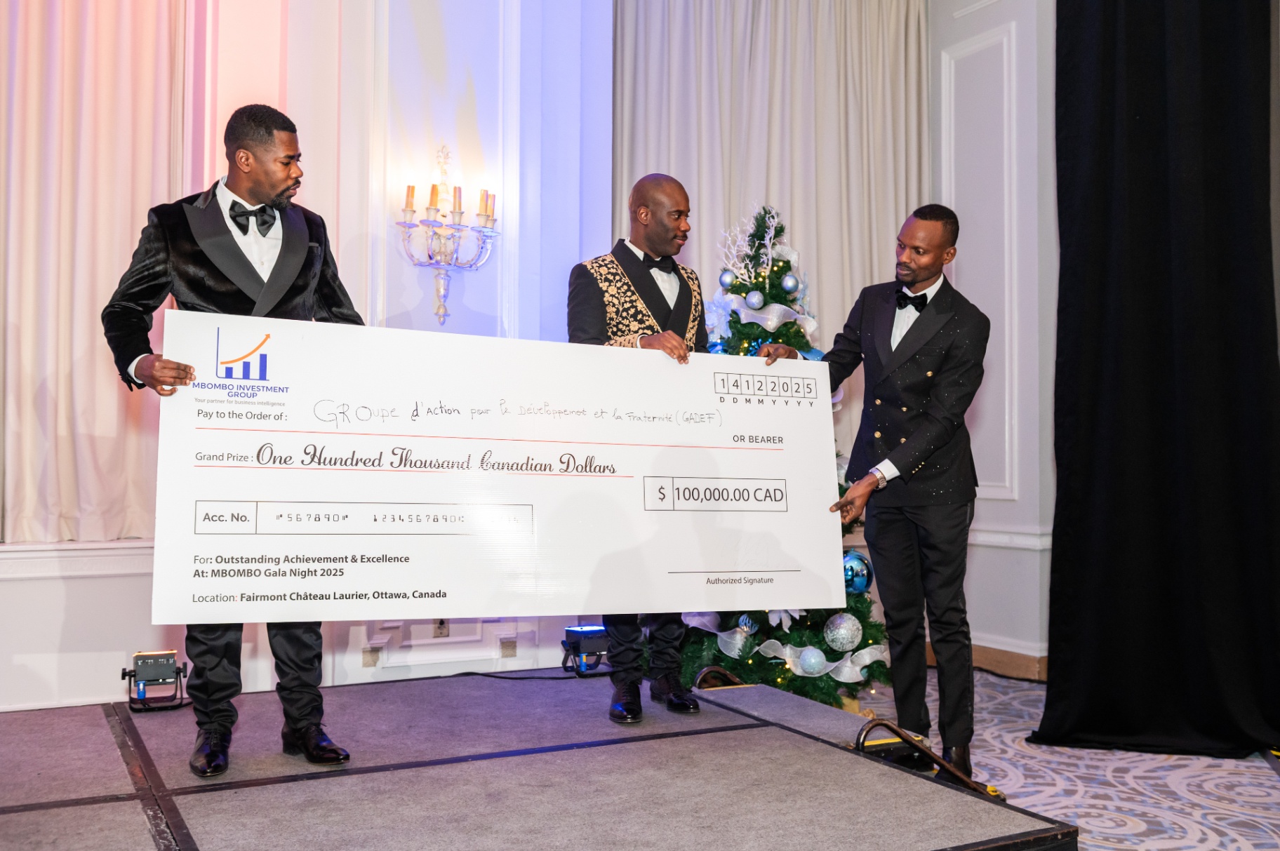 Stage presentation of the CA$100,000 award cheque in Ottawa