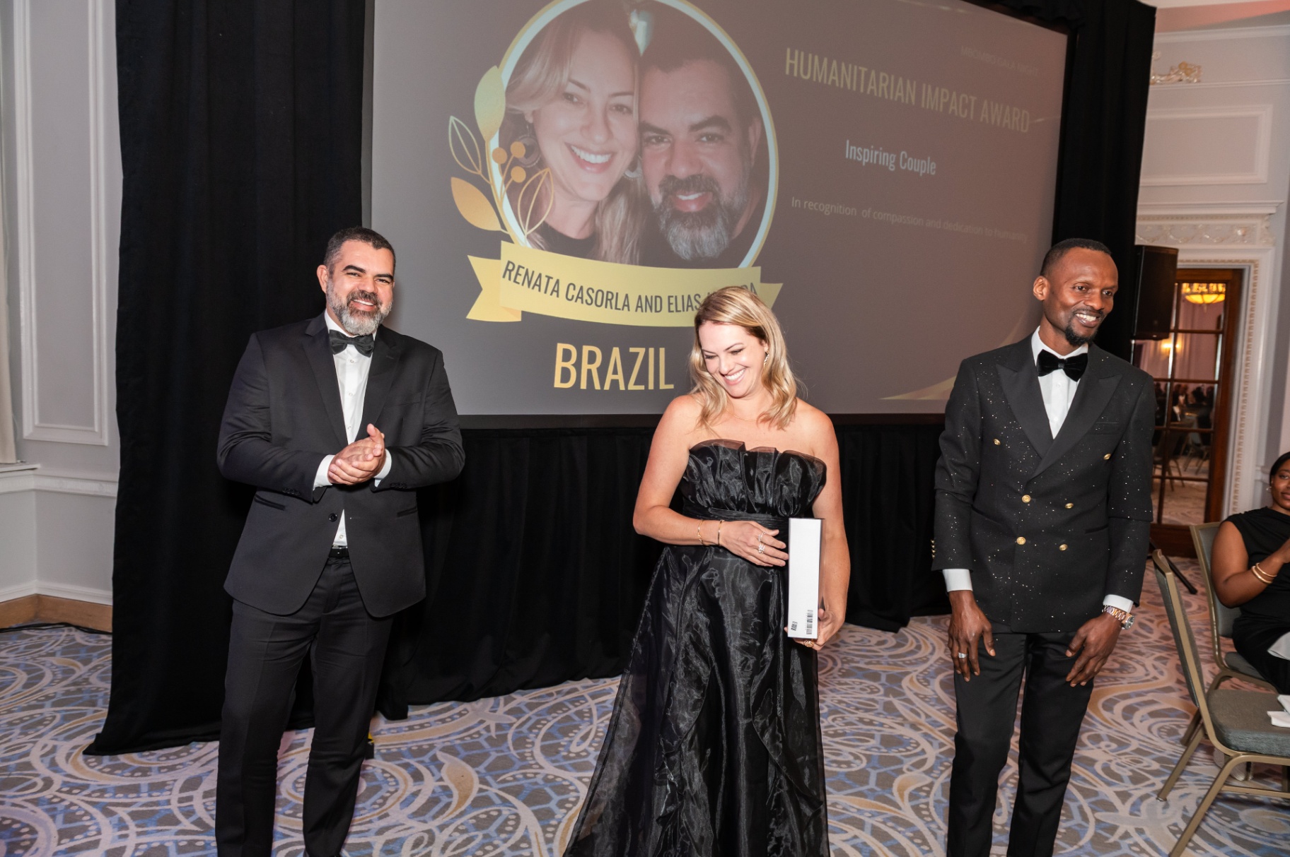 Humanitarian Impact Award recipients on stage with the Mbombo Gala Night host