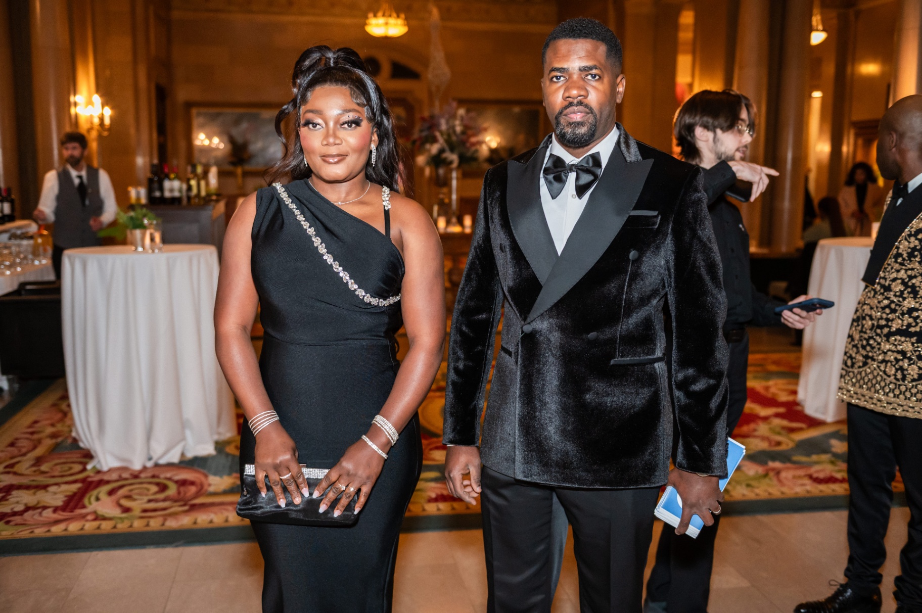 Elegant couple in black-tie attire during the gala reception