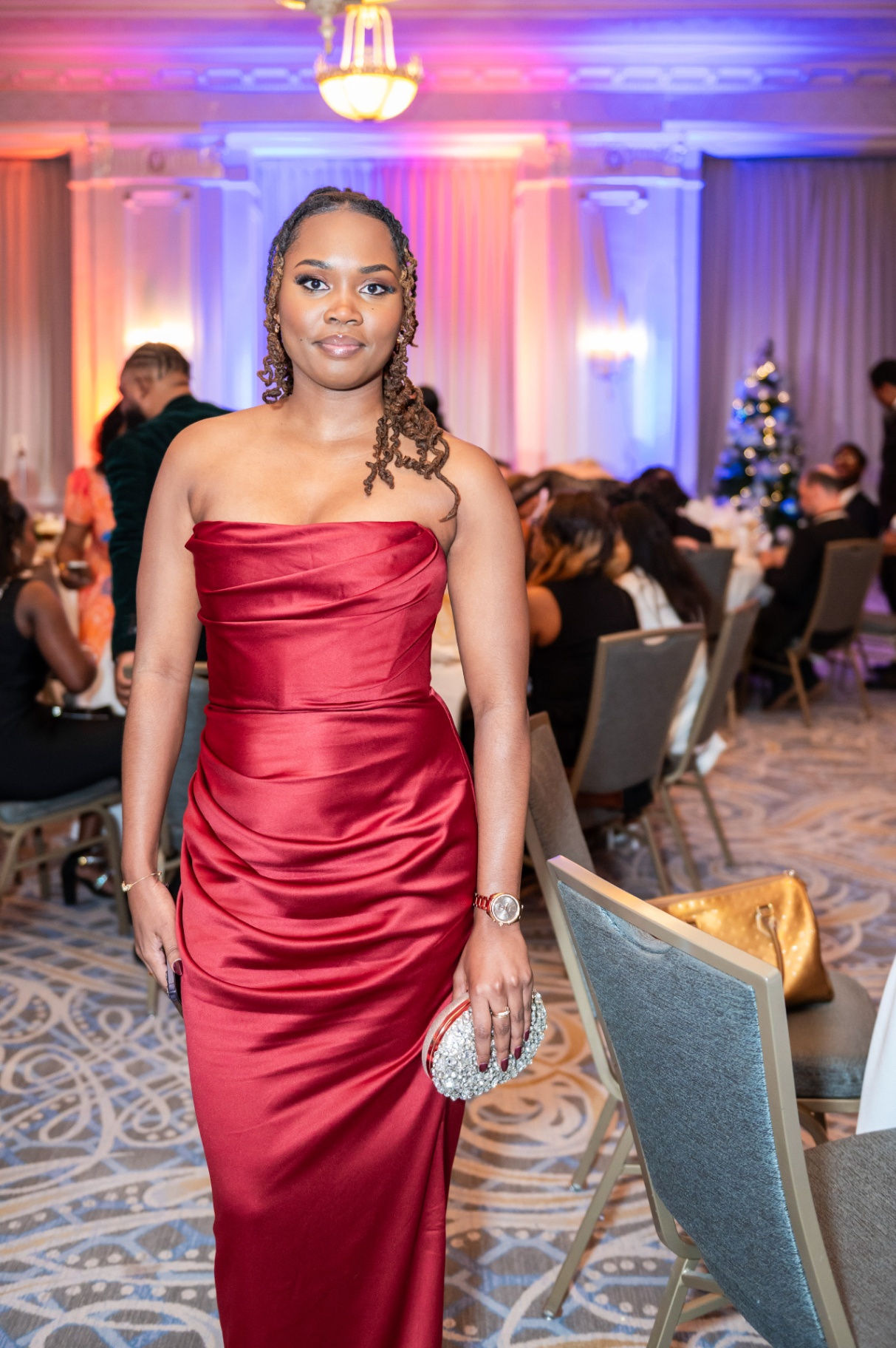 Close portrait with gala ballroom lighting in the background