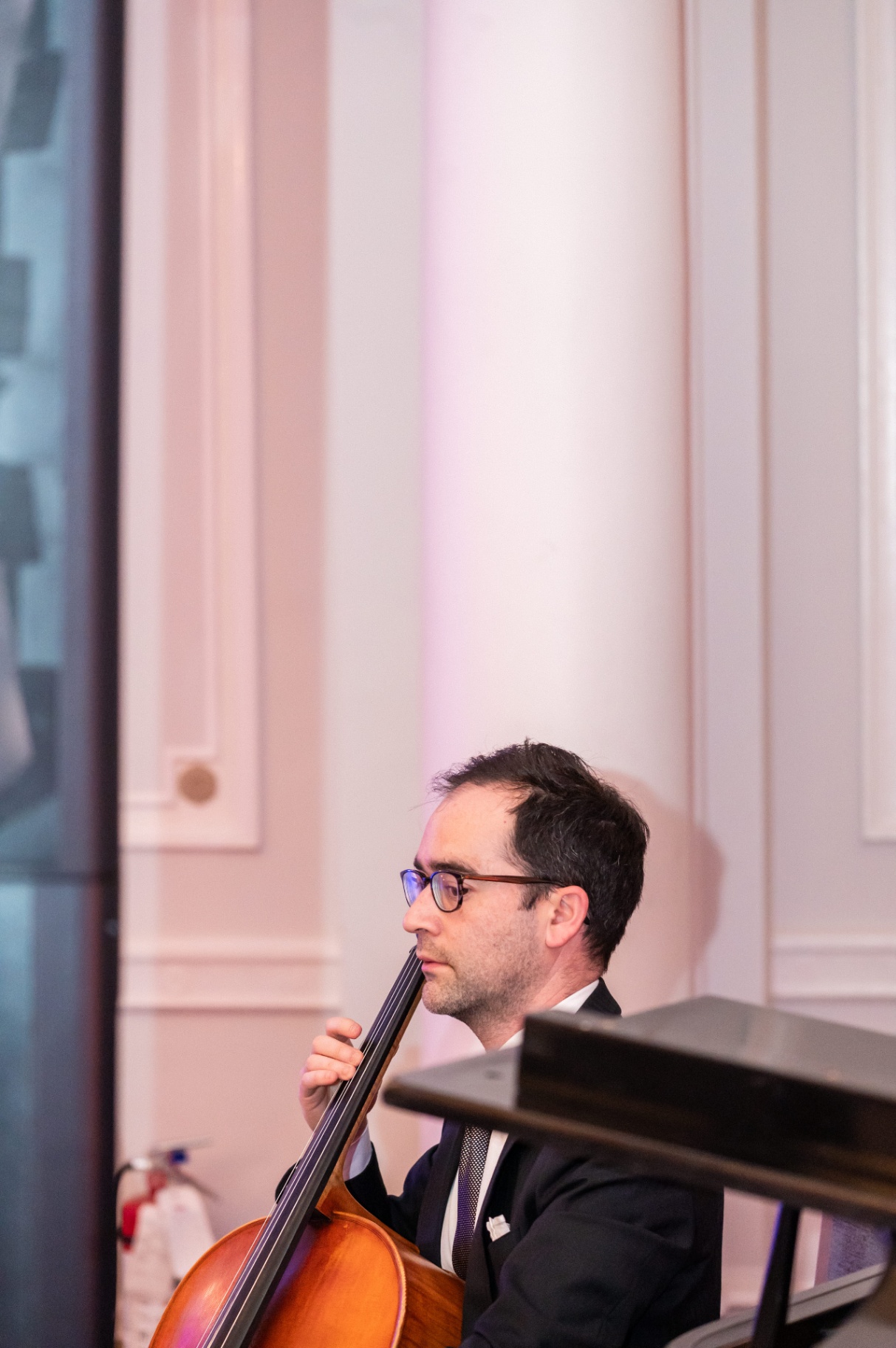 Cellist performing live chamber music during the gala reception