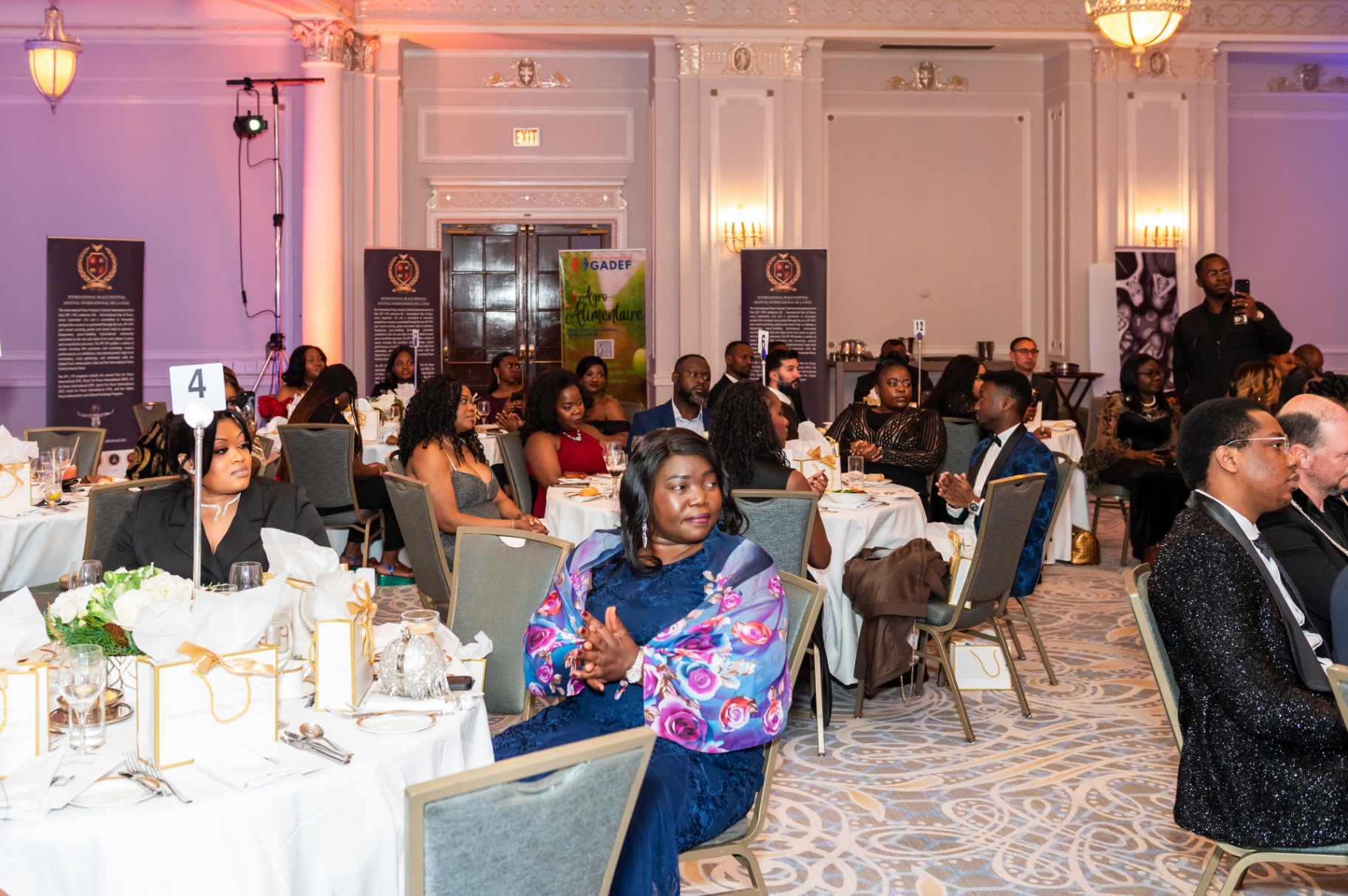 Attentive guests seated at gala tables during the evening program