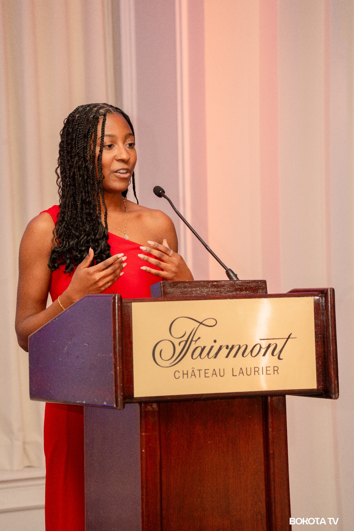2025 Mbombo Gala Night at the Fairmont Château Laurier — speaker in red gown, hosted by Mbombo Investment Group
