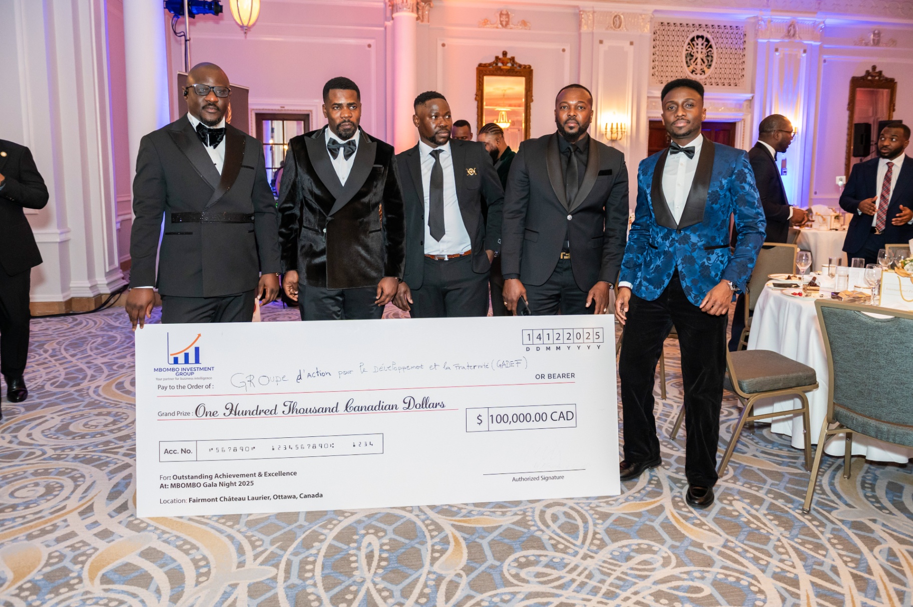 Award recipients with the ceremonial cheque at Mbombo Gala Night 2025