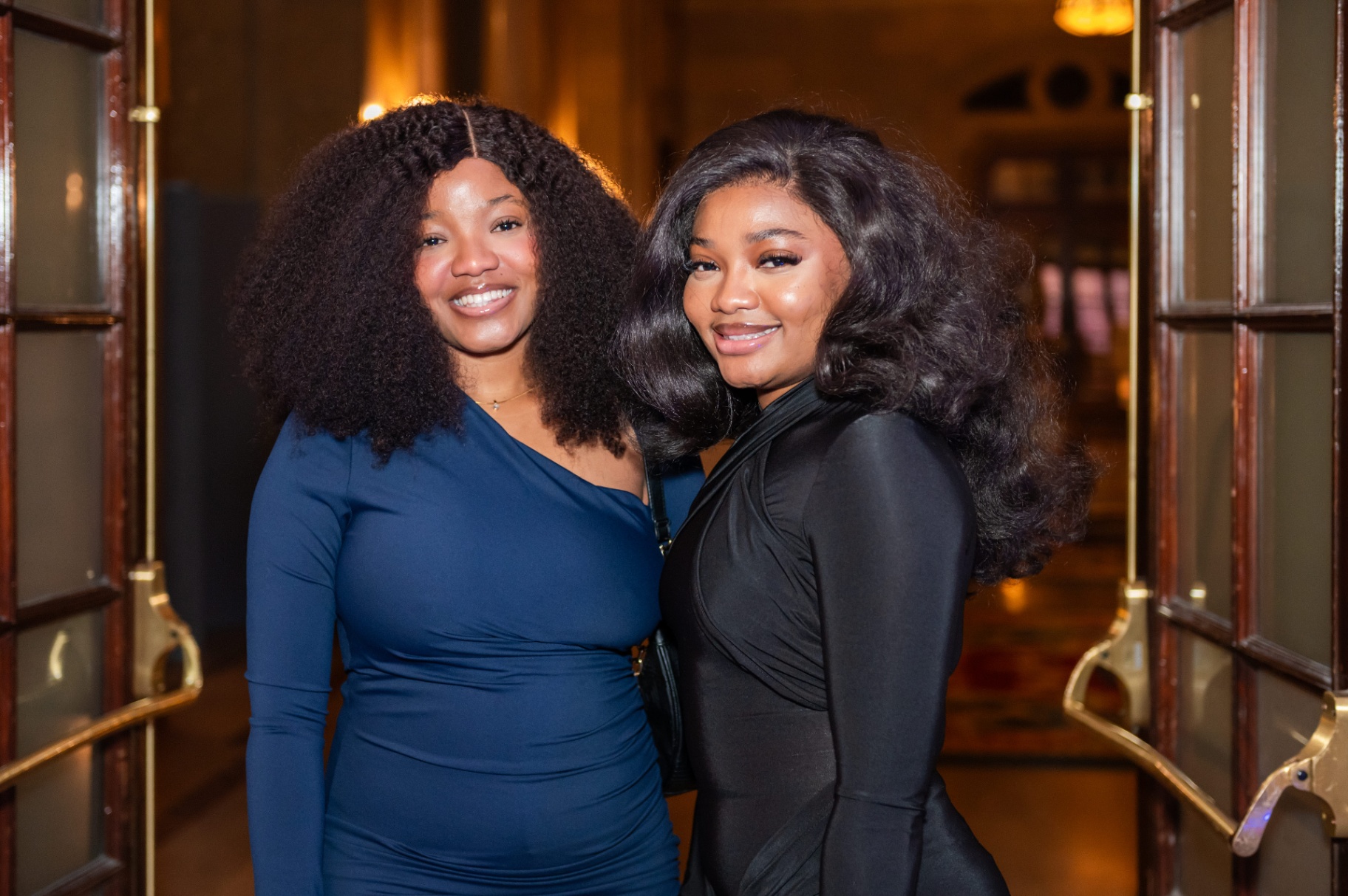 Two guests smiling together at the gala reception