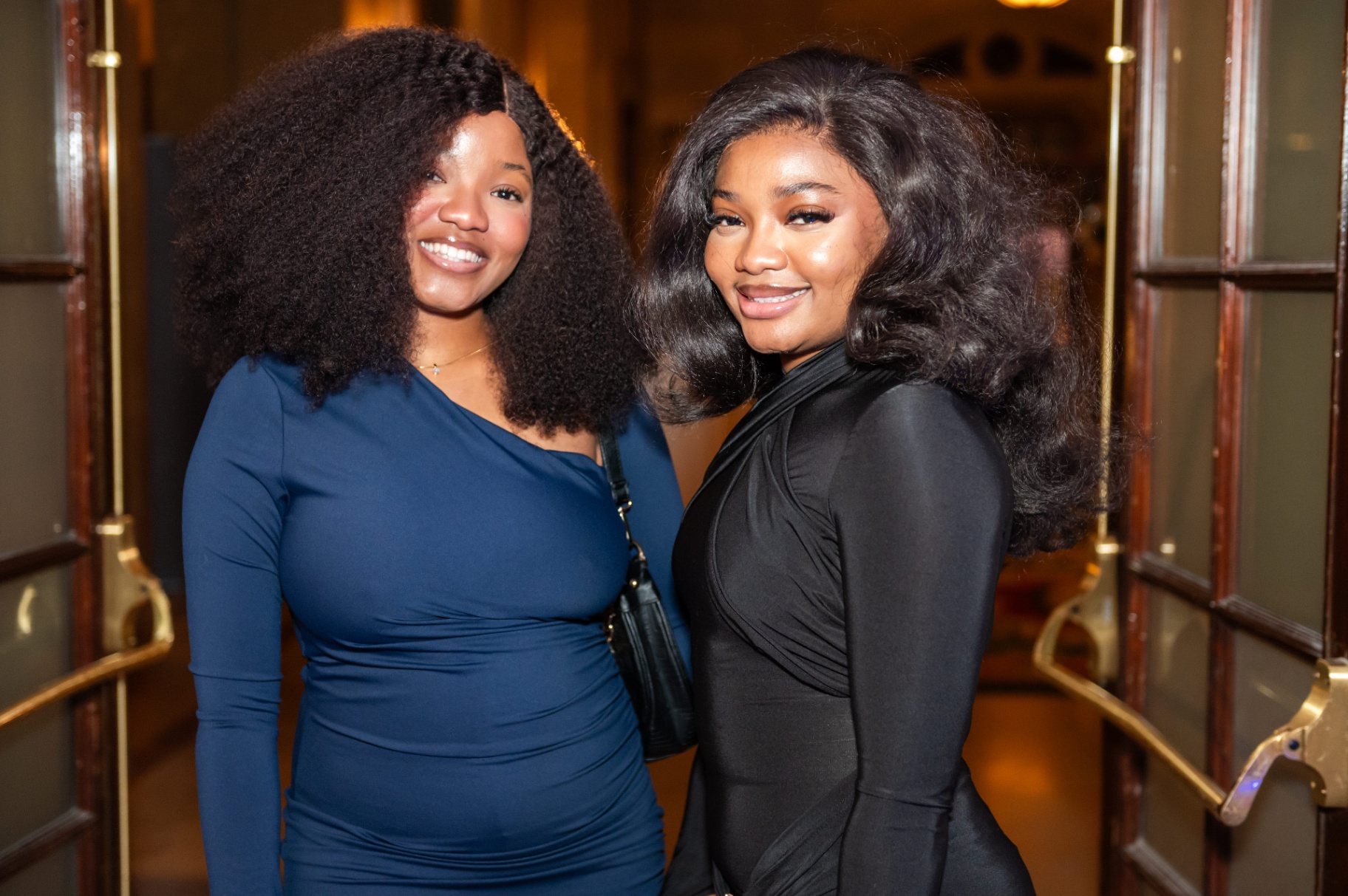Friends in elegant evening attire posing during the gala
