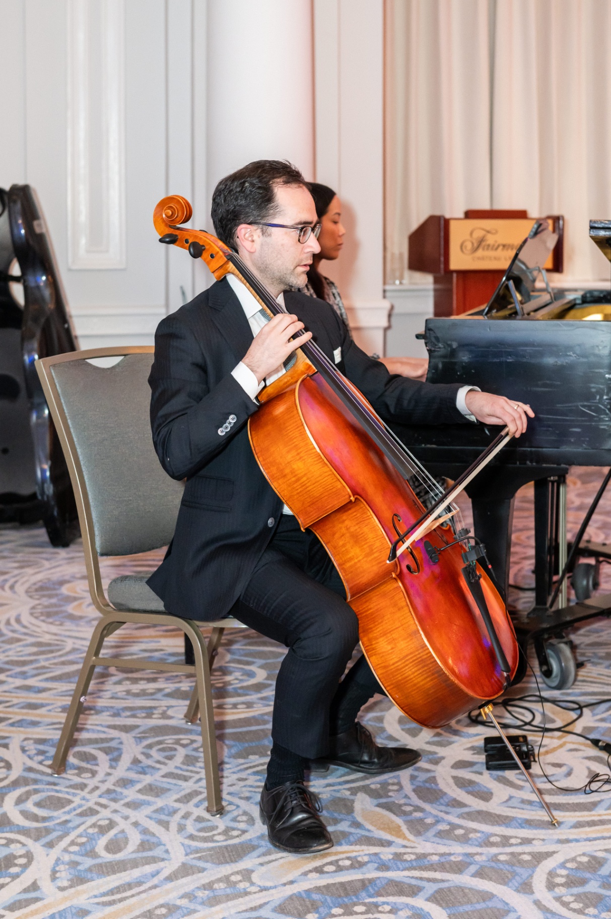 Cellist performing alongside the gala pianist at the Fairmont Château Laurier