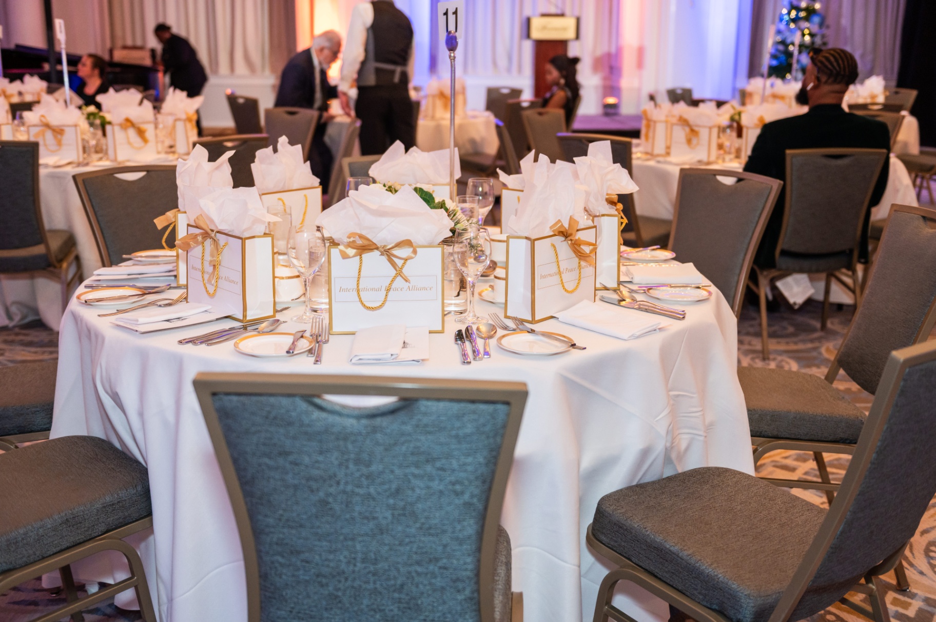 Table 11 set with International Peace Alliance gift bags at the Fairmont Château Laurier
